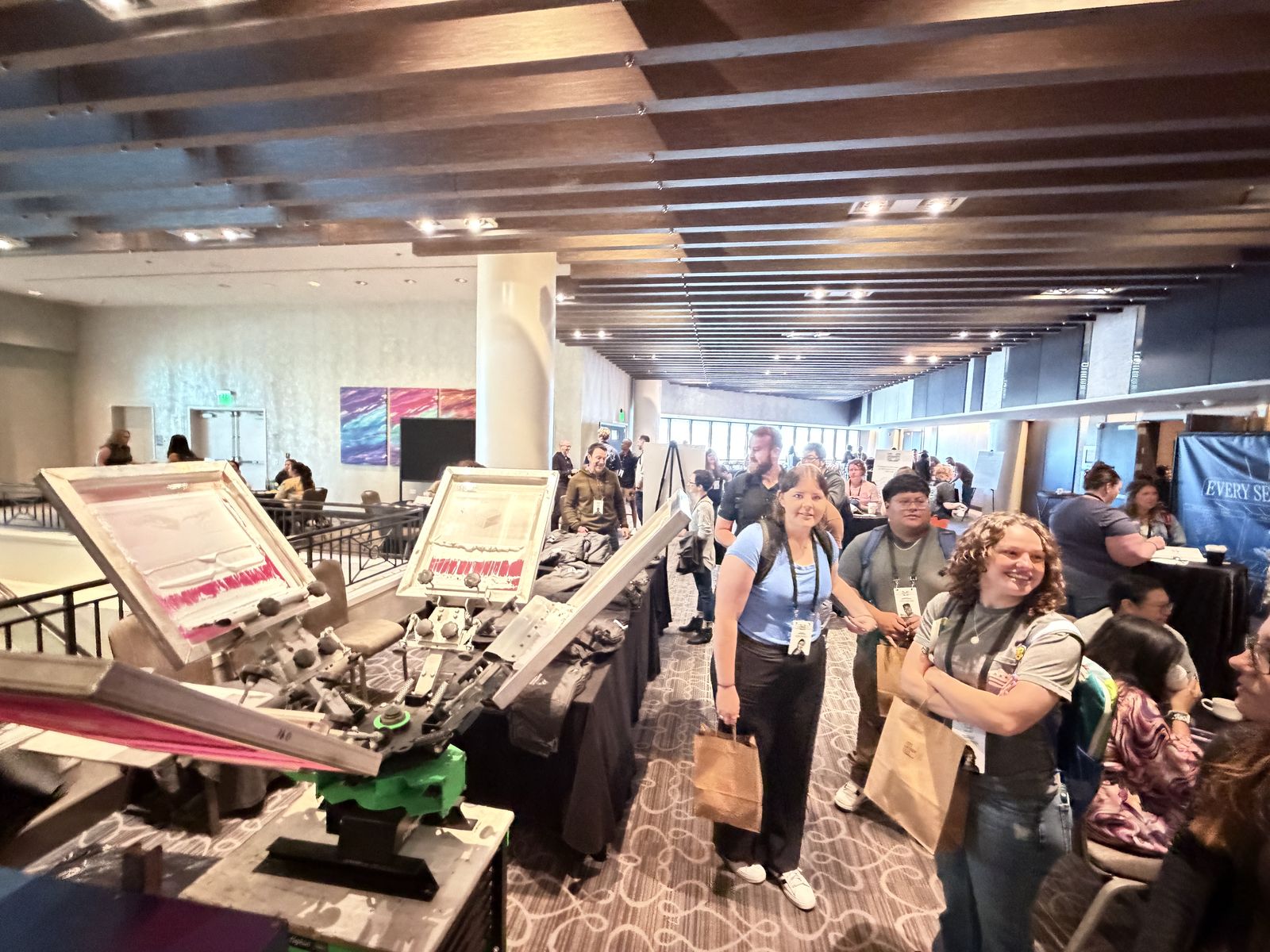 Merch Troop live screen-printing station running at an Anaheim expo